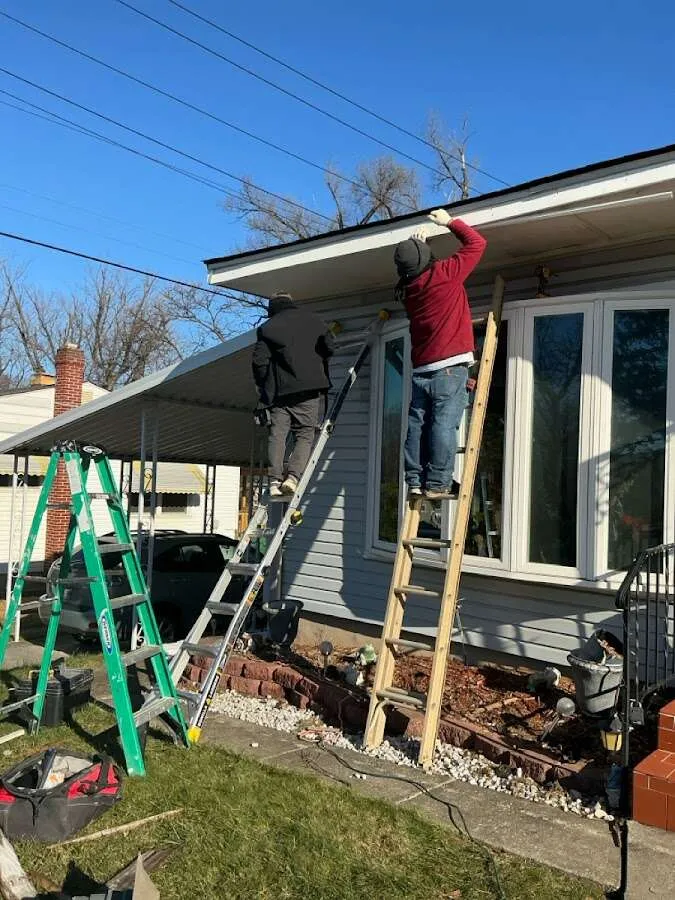 Restoration crew performing exterior repair in Kermit